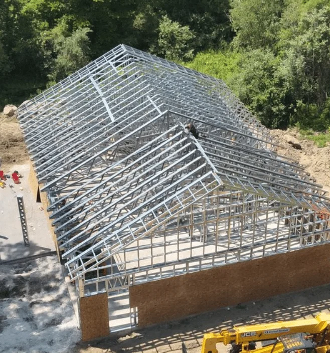 Aerial view of steel frame barndominium construction in Arkansas
